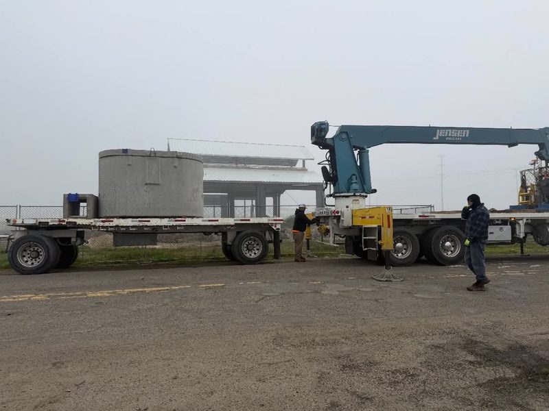 Boom truck delivering materials to the job site